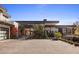 Modern home exterior with paver driveway and landscaping at 27951 N 96Th Pl, Scottsdale, AZ 85262