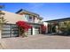 Modern home exterior with a paver driveway and lush landscaping at 27951 N 96Th Pl, Scottsdale, AZ 85262