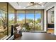 Bright home office features stunning views and a comfortable chaise lounge at 27951 N 96Th Pl, Scottsdale, AZ 85262
