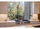 Modern kitchen features Wolf range and expansive window with scenic views at 27951 N 96Th Pl, Scottsdale, AZ 85262