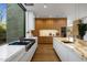 Modern kitchen with marble countertops and stainless steel appliances at 27951 N 96Th Pl, Scottsdale, AZ 85262