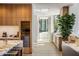 Luxury kitchen with marble island, wine fridge, and access to outdoor patio at 27951 N 96Th Pl, Scottsdale, AZ 85262