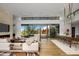 Spacious living room with floor-to-ceiling windows and a fireplace at 27951 N 96Th Pl, Scottsdale, AZ 85262