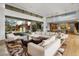 Light-filled living room with comfortable seating and views to the backyard at 27951 N 96Th Pl, Scottsdale, AZ 85262