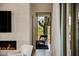 Living area with fireplace and view to a large cactus at 27951 N 96Th Pl, Scottsdale, AZ 85262
