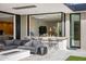 Covered patio features an outdoor bar and comfortable seating at 27951 N 96Th Pl, Scottsdale, AZ 85262