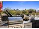 Stainless steel grill and outdoor kitchen with mountain views at 27951 N 96Th Pl, Scottsdale, AZ 85262