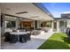 Large patio with multiple seating areas and kitchen access at 27951 N 96Th Pl, Scottsdale, AZ 85262