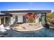 Stunning pool with a rock feature and bougainvillea at 27951 N 96Th Pl, Scottsdale, AZ 85262