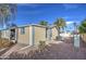 Backyard exterior featuring an AC unit and a palm tree at 3104 E Broadway Rd # 16, Mesa, AZ 85204