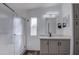 Bathroom featuring a stand-up shower, large cabinets and modern lighting at 3104 E Broadway Rd # 16, Mesa, AZ 85204