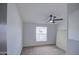 Bedroom featuring a ceiling fan and window with carpet flooring at 3104 E Broadway Rd # 16, Mesa, AZ 85204