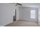 Carpeted bedroom with ensuite bathroom, good natural light from a large window at 3104 E Broadway Rd # 16, Mesa, AZ 85204