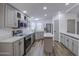 Charming kitchen features stainless steel appliances and white stone countertops with an island at 3104 E Broadway Rd # 16, Mesa, AZ 85204