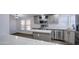 Charming kitchen features stainless steel appliances, a center island, and white stone countertops at 3104 E Broadway Rd # 16, Mesa, AZ 85204