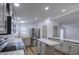 Charming kitchen features stainless steel appliances, and white stone countertops with a central island at 3104 E Broadway Rd # 16, Mesa, AZ 85204