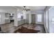 Bright living room features wood floors, modern lighting, and open kitchen access at 3104 E Broadway Rd # 16, Mesa, AZ 85204