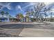 Exterior street view of home featuring gravel landscaping and carports at 3104 E Broadway Rd # 16, Mesa, AZ 85204