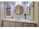 Bathroom featuring a sink with storage, vibrant colored mirror and accent lighting at 3104 E Broadway Rd # 4, Mesa, AZ 85204