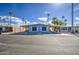 Inviting single-story home showcases covered parking and an attractive yard with mature palm trees, offering comfortable living at 3104 E Broadway Rd # 4, Mesa, AZ 85204