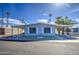 Delightful single-story residence featuring convenient covered parking and landscaped front, enhanced by towering palm trees at 3104 E Broadway Rd # 4, Mesa, AZ 85204