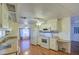 Functional kitchen featuring white appliances, ample counter space, and wood-look flooring for a comfortable cooking experience at 3104 E Broadway Rd # 4, Mesa, AZ 85204