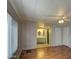 Living area with bathroom, showcasing laminate flooring and neutral tones at 3104 E Broadway Rd # 4, Mesa, AZ 85204