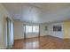Bright living room with wood flooring and natural light from the windows at 3104 E Broadway Rd # 4, Mesa, AZ 85204