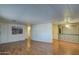 Open living area showcasing wood floors, with built-in cabinetry and ample space at 3104 E Broadway Rd # 4, Mesa, AZ 85204