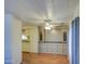Living room with wood look floors, window with blinds and curtains, and built in cabinetry at 3104 E Broadway Rd # 4, Mesa, AZ 85204
