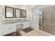 Bathroom with double sinks, granite countertop, soaking tub, and shower at 3435 E Desert Trumpet Rd, Phoenix, AZ 85044