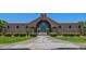 Attractive community entrance with arched entryway and lush landscaping at 3435 E Desert Trumpet Rd, Phoenix, AZ 85044