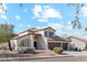 Two-story house with tile roof, two-car garage, and desert landscaping at 3435 E Desert Trumpet Rd, Phoenix, AZ 85044