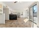 Kitchen with breakfast bar, stainless steel appliances, and backyard access at 3435 E Desert Trumpet Rd, Phoenix, AZ 85044