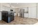 Kitchen with stainless steel appliances and breakfast bar at 3435 E Desert Trumpet Rd, Phoenix, AZ 85044