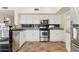 Kitchen with stainless steel appliances and white cabinets at 3435 E Desert Trumpet Rd, Phoenix, AZ 85044