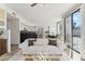 Bright living room featuring an open kitchen and sliding glass doors to the backyard, perfect for entertaining at 3435 E Desert Trumpet Rd, Phoenix, AZ 85044
