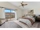 Serene main bedroom with a private balcony and mountain views, offering a tranquil retreat at 3435 E Desert Trumpet Rd, Phoenix, AZ 85044