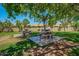 Community picnic area with shaded tables and lush landscaping at 3435 E Desert Trumpet Rd, Phoenix, AZ 85044
