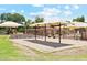 Sand playground with swings and shade at 3435 E Desert Trumpet Rd, Phoenix, AZ 85044