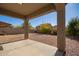 Covered patio and gravel backyard with desert landscaping at 4337 W Powell Dr, Phoenix, AZ 85087
