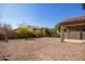 Spacious backyard with gravel and mature desert plants at 4337 W Powell Dr, Phoenix, AZ 85087