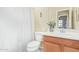 Clean bathroom with wood vanity and shower/tub combo at 4337 W Powell Dr, Phoenix, AZ 85087