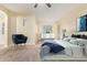 Spacious bedroom with large window and ceiling fan at 4337 W Powell Dr, Phoenix, AZ 85087