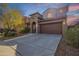 Two story home with attached garage and landscaped front yard at 4337 W Powell Dr, Phoenix, AZ 85087