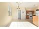 Bright kitchen with light cabinets and tile floor at 4337 W Powell Dr, Phoenix, AZ 85087