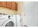 Laundry room with washer, dryer, and upper cabinets at 4337 W Powell Dr, Phoenix, AZ 85087