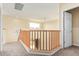 Upstairs hallway with wood railing and carpet at 4337 W Powell Dr, Phoenix, AZ 85087