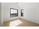 Bright bedroom with wood floors and large windows providing lots of natural light at 4445 E Roma Ave, Phoenix, AZ 85018