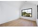 Bright bedroom with wood floors and large windows providing lots of natural light at 4445 E Roma Ave, Phoenix, AZ 85018